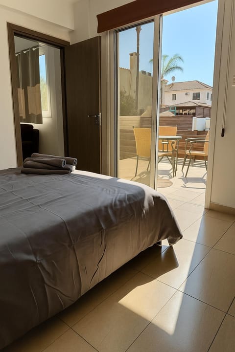 Patio, Patio, Bed, Day, People, Neighbourhood, Summer, Balcony/Terrace, Balcony/Terrace, Photo of the whole room, Seating area, Dining area, Bedroom, Text overlay, Location, Sunset, hair dryier, VIP, wardrobe, air conditioner, air conditioner
