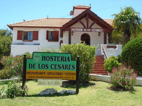 Property building, Facade/entrance, Day, Property logo or sign, Garden, Lobby or reception, Text overlay