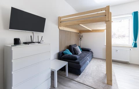 Bed, TV and multimedia, Living room, Seating area