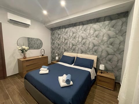 Bed, Photo of the whole room, Bedroom, towels, air conditioner