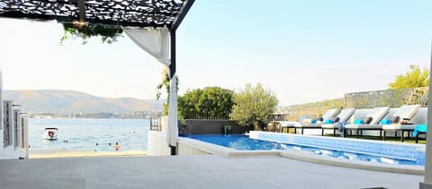 Patio, Day, Natural landscape, Garden, Beach, Pool view, Sea view, Swimming pool, sunbed