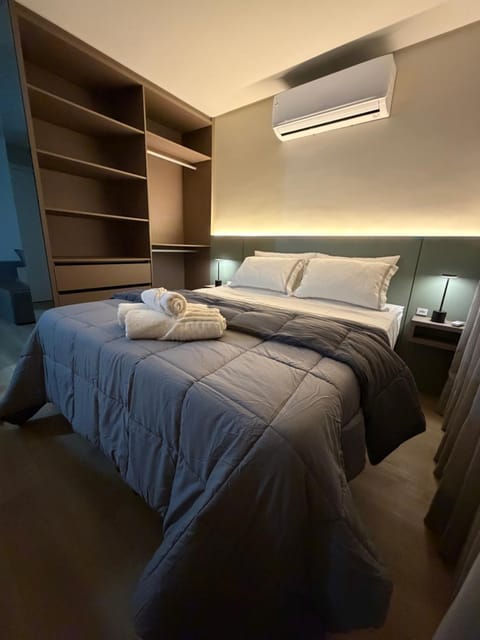 Bed, Photo of the whole room, Bedroom, towels, air conditioner