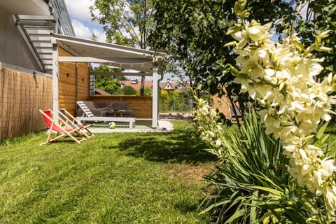 Property building, Patio, Garden, Garden view, sunbed