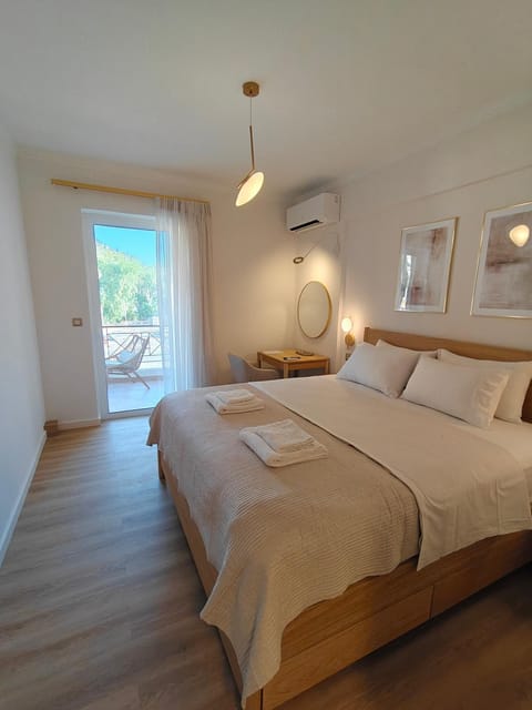 Bed, Day, View (from property/room), Photo of the whole room, Decorative detail, Bedroom, City view, Landmark view, Mountain view, Time of day, towels, air conditioner