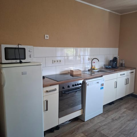 Kitchen or kitchenette, dishwasher, oven, stove, toaster