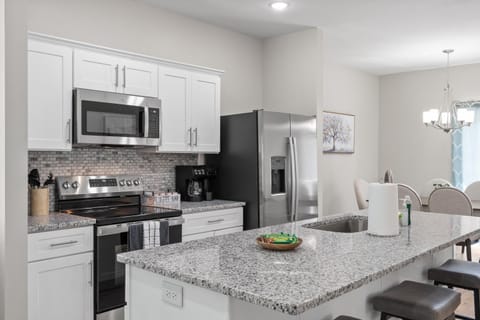 Kitchen or kitchenette, dishwasher, oven, stove, toaster