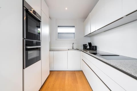 Kitchen or kitchenette, dishwasher, oven, stove, toaster