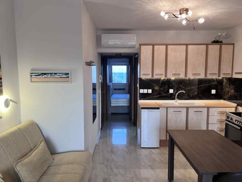 Kitchen or kitchenette, Seating area, Dining area, oven, stove, air conditioner