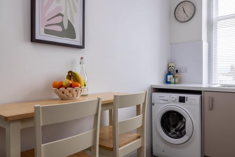 Kitchen or kitchenette, washing machine
