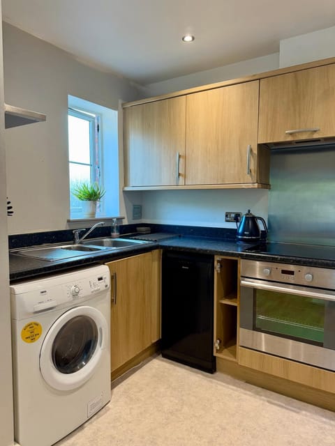 Kitchen or kitchenette, dishwasher, washing machine, dryer