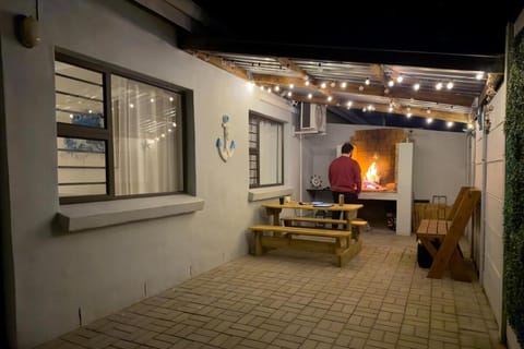 Patio, Night, People, BBQ facilities, Seating area, group of guests