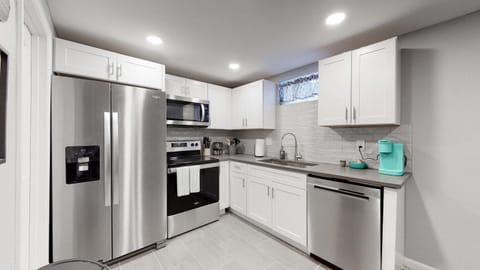 Kitchen or kitchenette, dishwasher, microwave, oven, stove