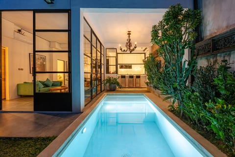 Property building, Patio, Night, Garden, Pool view, Swimming pool