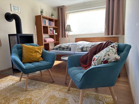 Bed, Living room, Seating area, Bedroom