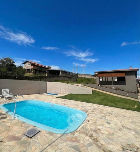 Property building, Day, Pool view, Swimming pool, sunbed