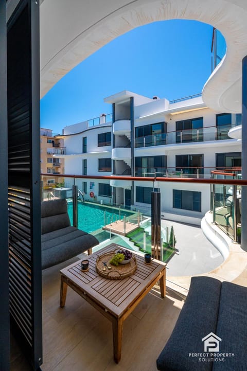 View (from property/room), Balcony/Terrace, Seating area, Pool view, Swimming pool