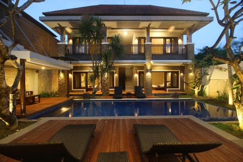 Property building, Patio, Night, Pool view, Swimming pool, sunbed