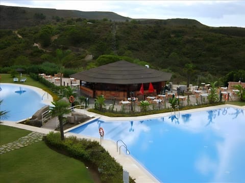 Property building, Living room, Swimming pool