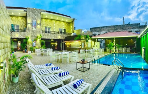 Property building, Day, Evening entertainment, Pool view, Swimming pool