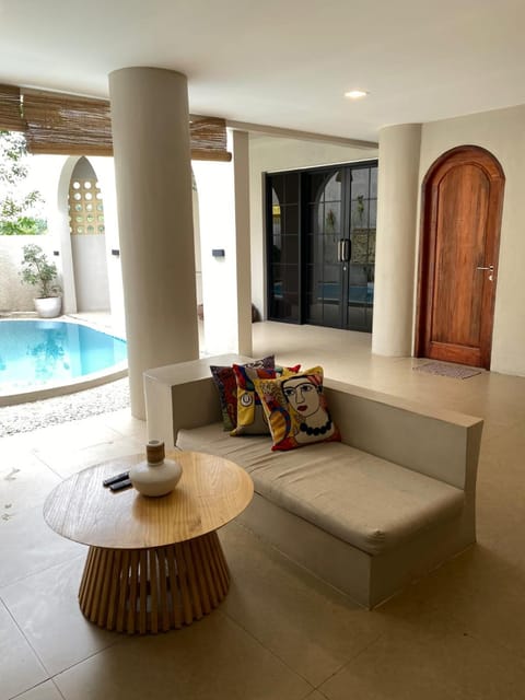 Living room, Seating area, Pool view