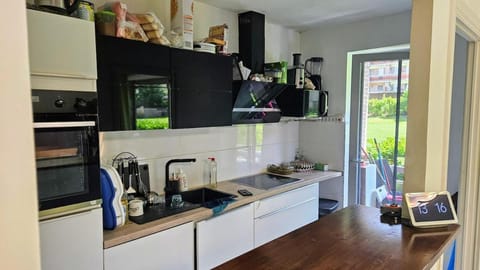 Kitchen or kitchenette, dishwasher, stove, toaster