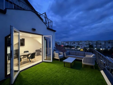 Property building, Communal lounge/ TV room, Night, View (from property/room), Balcony/Terrace, Living room, Seating area, Evening entertainment