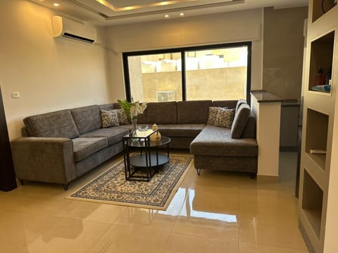 Communal lounge/ TV room, TV and multimedia, Living room, Seating area, air conditioner