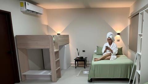 Photo of the whole room, bunk bed, internet, air conditioner