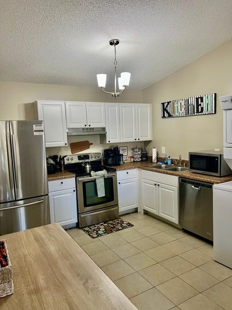 Kitchen or kitchenette, dishwasher, oven, stove, toaster