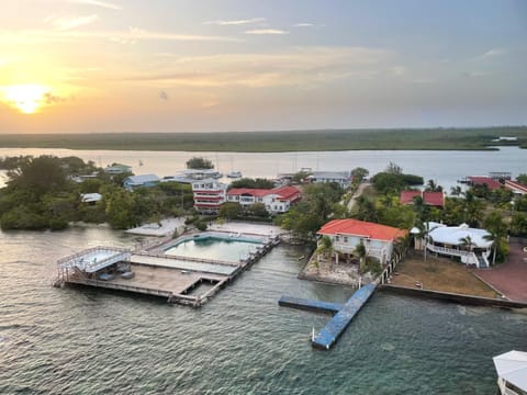 Property building, Natural landscape, Bird's eye view, View (from property/room), Sea view, Swimming pool, Sunset