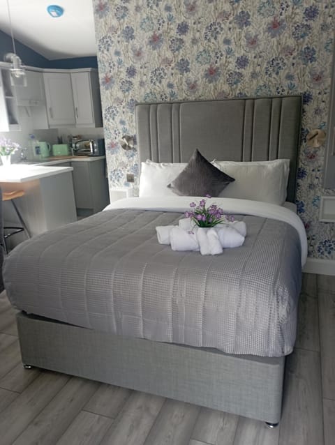 Bed, towels, wardrobe