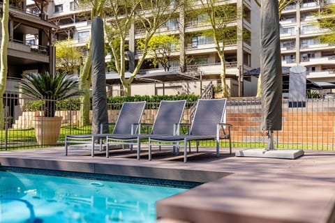 Property building, Patio, Pool view, Swimming pool, sunbed