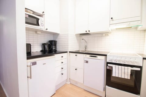 Kitchen or kitchenette, dishwasher, oven, stove, toaster