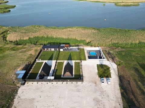 Property building, Natural landscape, Bird's eye view, Lake view, Pool view, Swimming pool