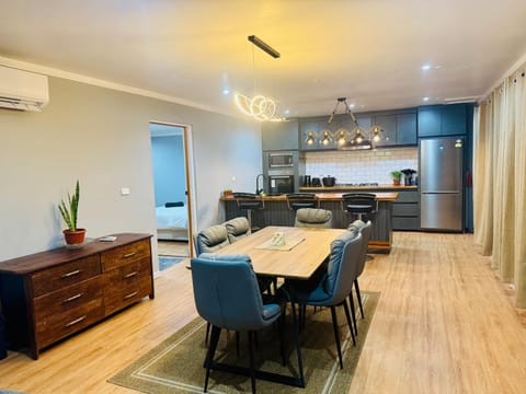 Kitchen or kitchenette, Living room, Seating area, Dining area, oven, stove, air conditioner
