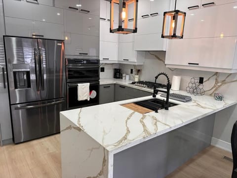 Kitchen or kitchenette, dishwasher, oven, stove