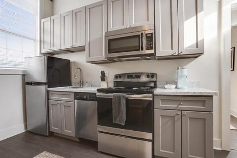 Kitchen or kitchenette, dishwasher, oven, stove, toaster