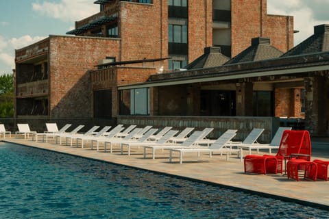 Property building, Day, Pool view, Swimming pool, sunbed