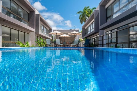 Property building, Day, Pool view, Swimming pool, sunbed