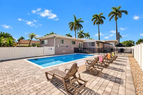 Property building, Patio, Pool view, Swimming pool, sunbed