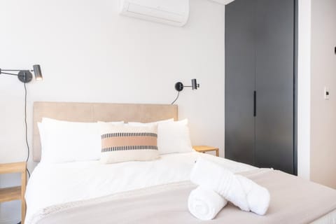 Bed, towels, wardrobe, air conditioner