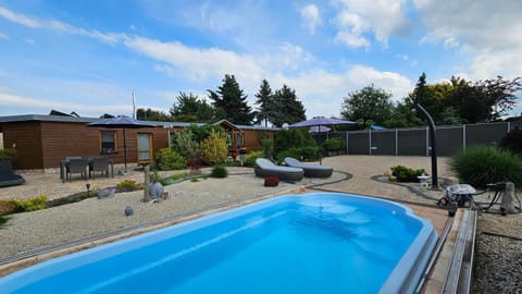 Property building, Garden, Pool view, Swimming pool, sunbed
