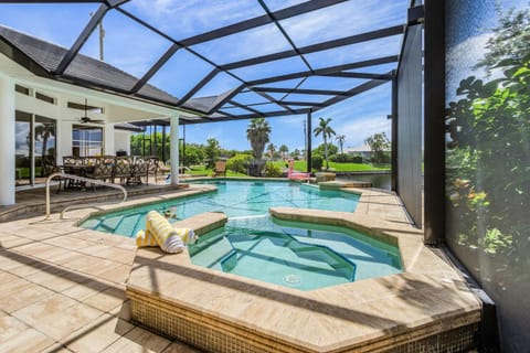 Riverfront Luxury with Heated Pool, Spa & Private Dock - Sunny Shores Escape House in Cape Coral