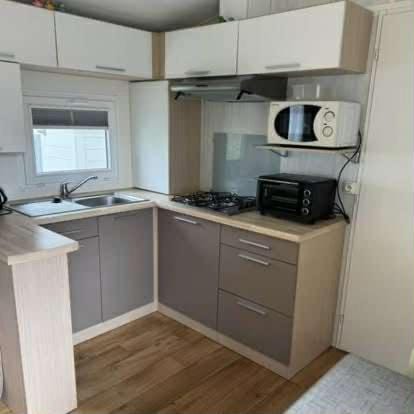 Kitchen or kitchenette, stove