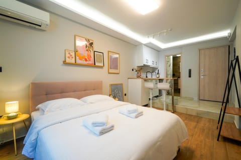 Bed, Photo of the whole room, Bedroom, towels, air conditioner