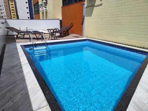 Swimming pool, sunbed
