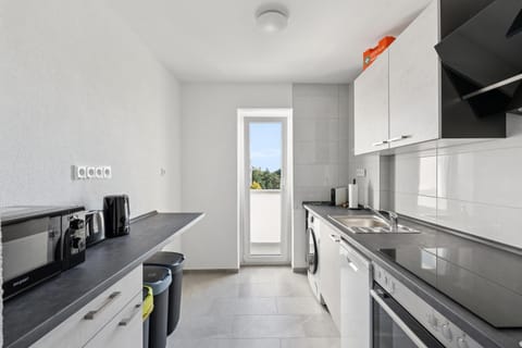 Kitchen or kitchenette, dishwasher, oven, stove, toaster
