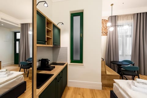 Bed, Kitchen or kitchenette, Seating area, towels