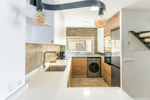 Kitchen or kitchenette, stove, washing machine