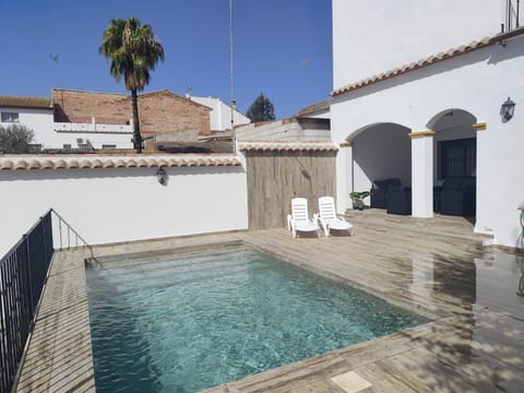 Property building, Patio, Pool view, Swimming pool, sunbed